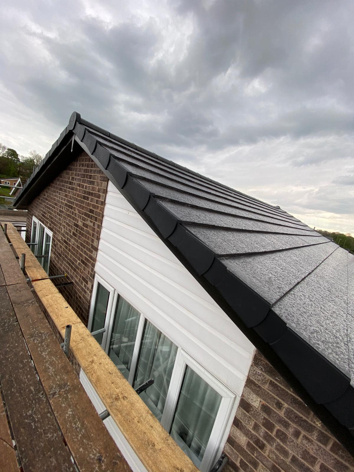 Professional roofers working on a property in London - KS Roof Master