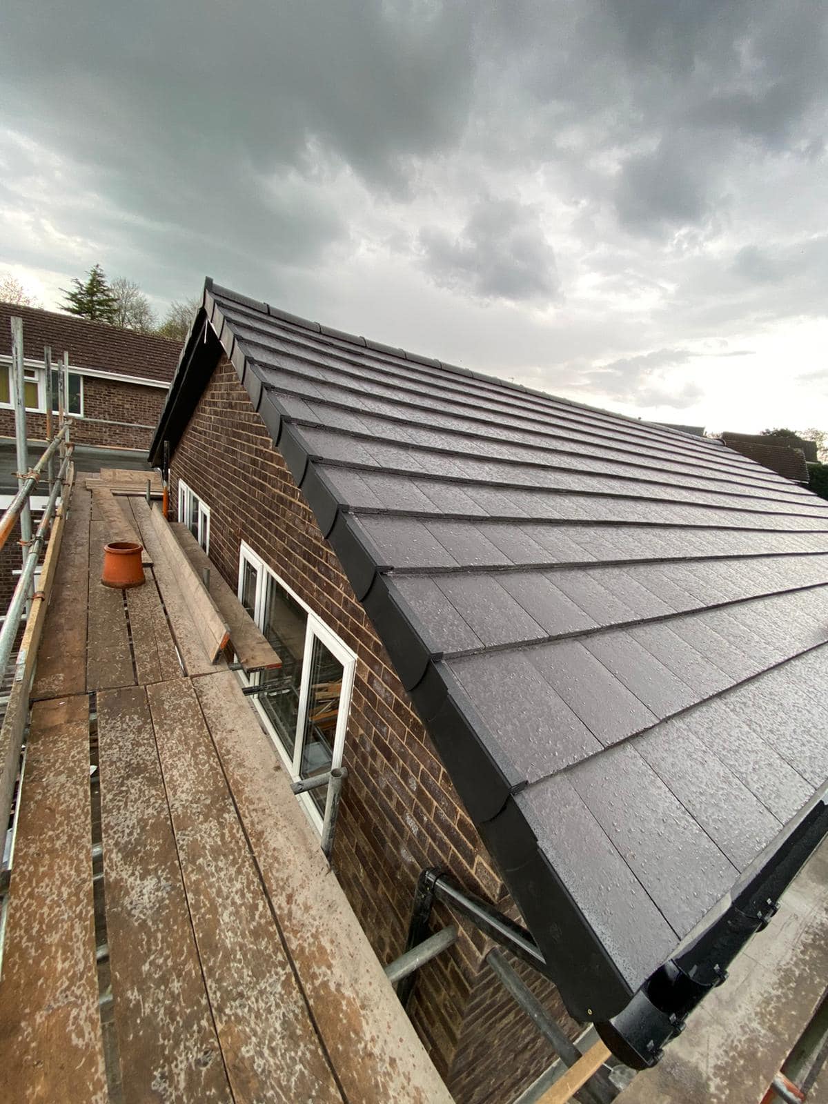 Professional roofers working on a property in London - KS Roof Master