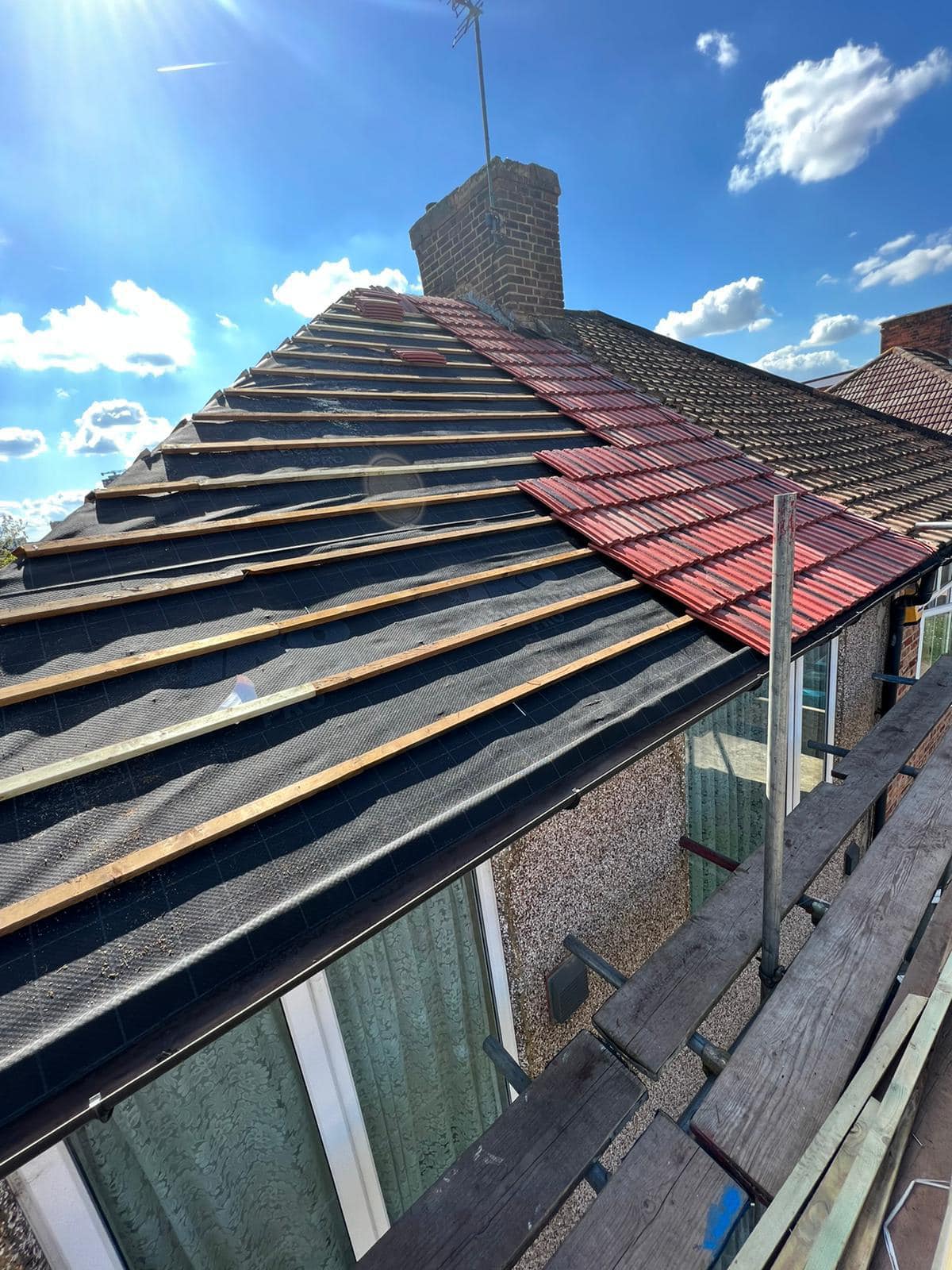 Professional roofers working on a property in London - KS Roof Master