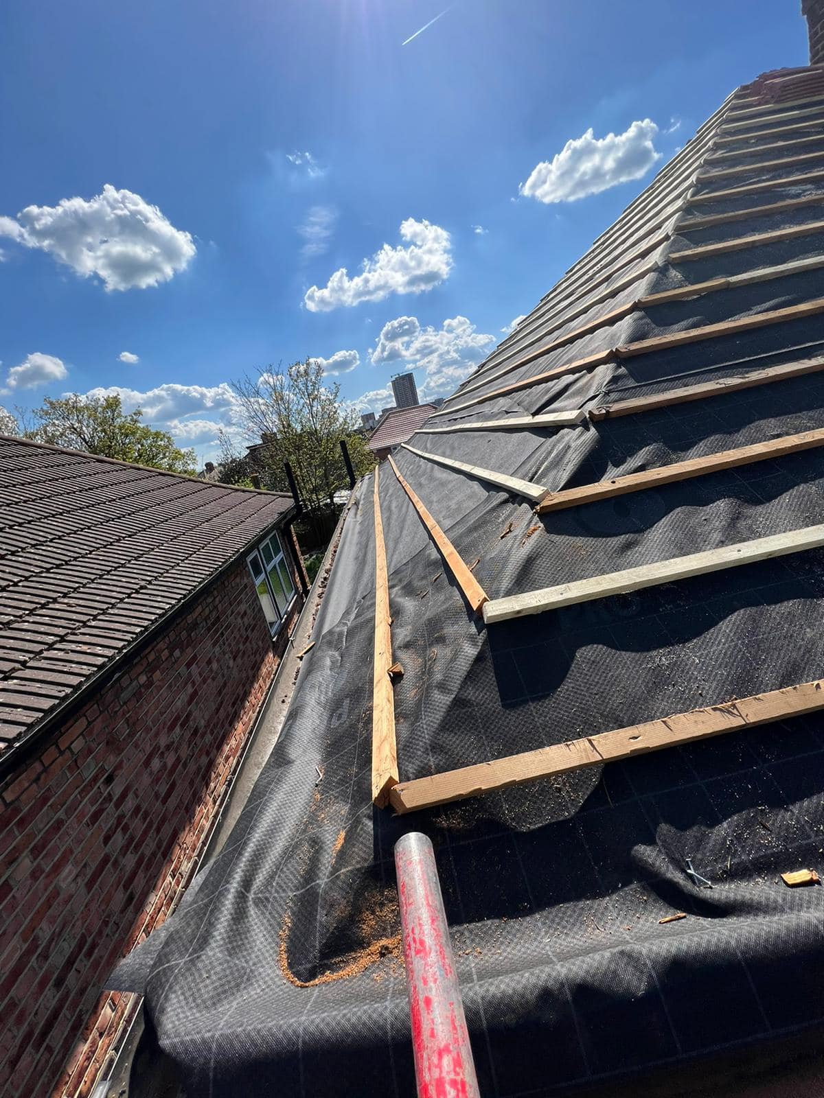 Professional roofers working on a property in London - KS Roof Master