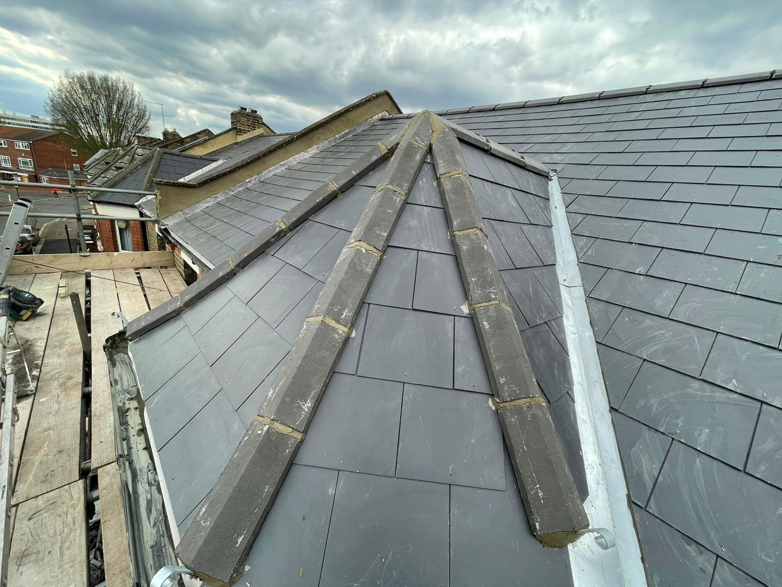 Professional roofers working on a property in London - KS Roof Master