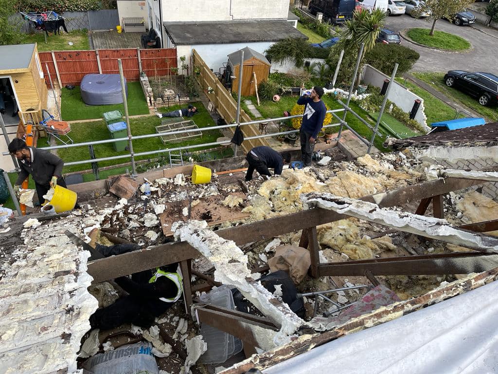 Professional roofers working on a property in London - KS Roof Master