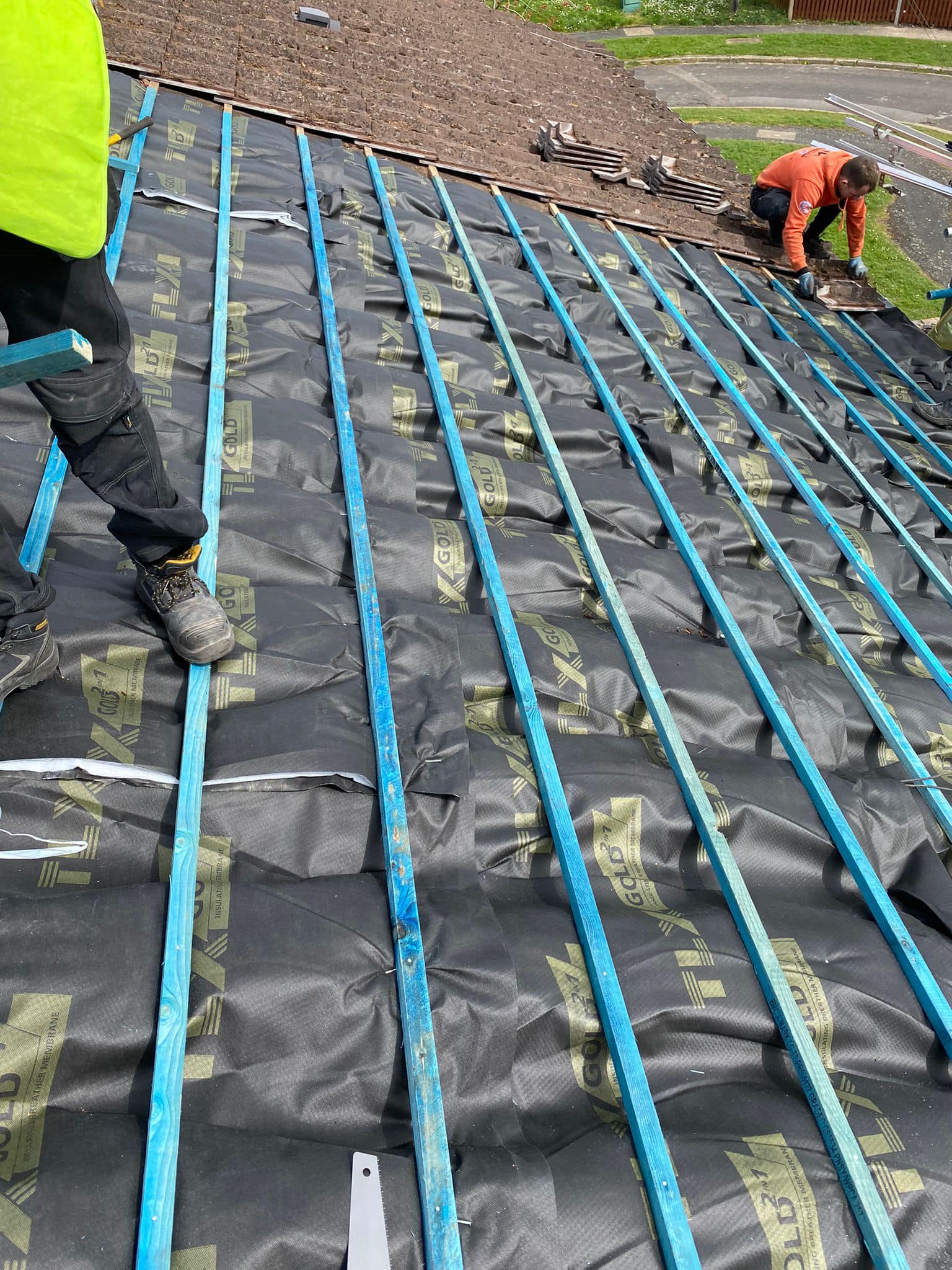Professional roofers working on a property in London - KS Roof Master