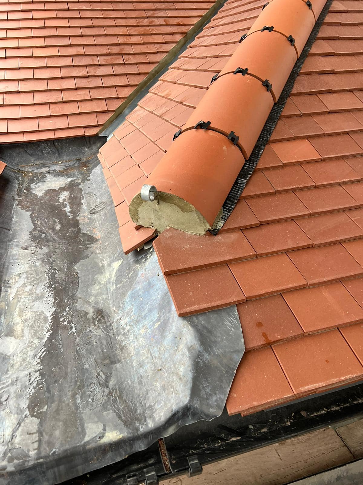 Professional roofers working on a property in London - KS Roof Master