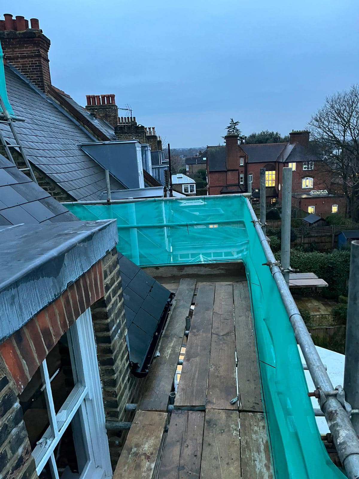 Professional roofers working on a property in London - KS Roof Master