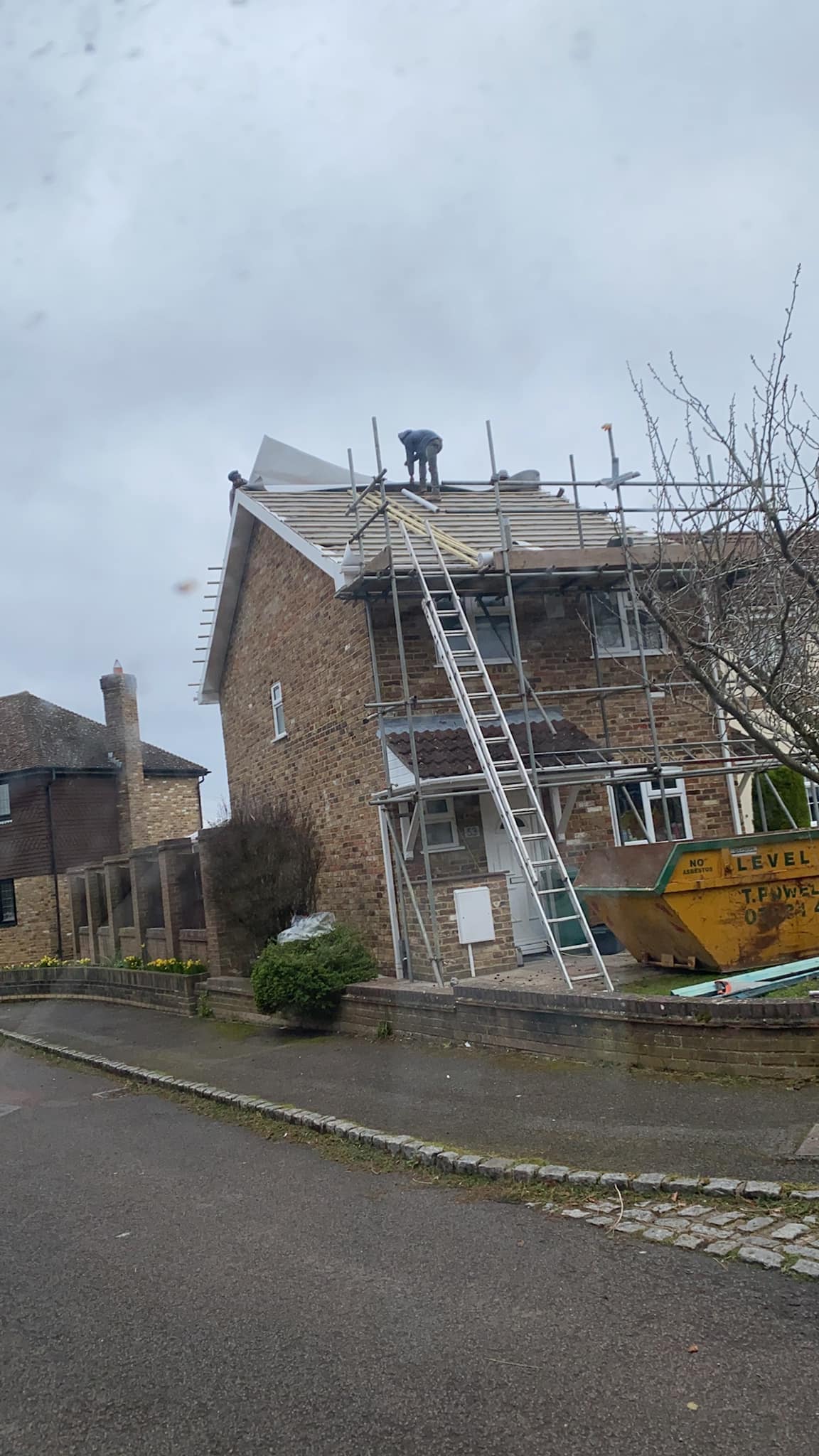 Professional roofers working on a property in London - KS Roof Master
