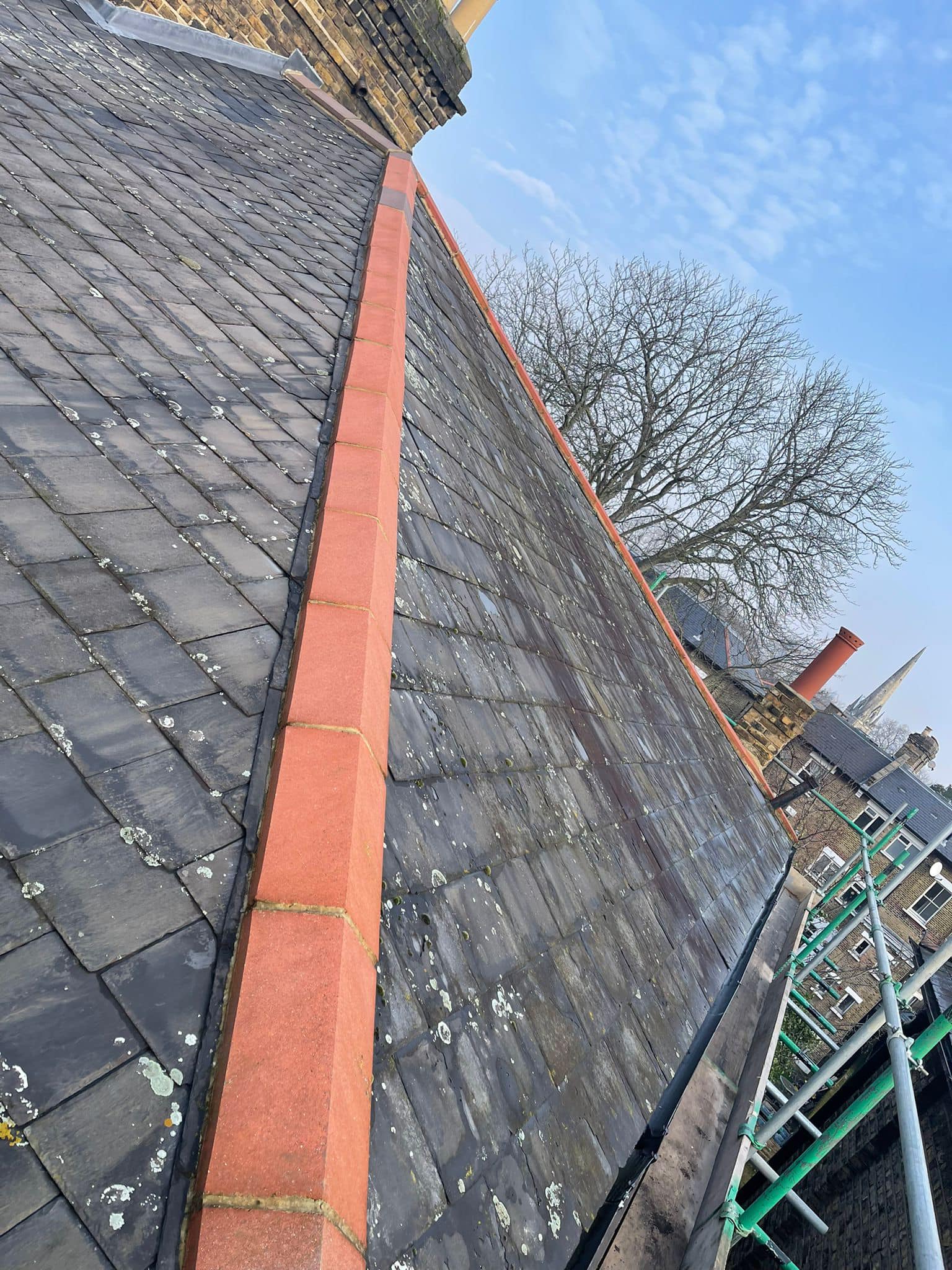 Professional roofers working on a property in London - KS Roof Master