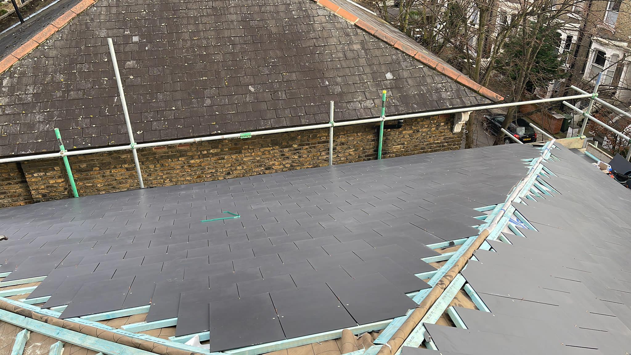 Professional roofers working on a property in London - KS Roof Master