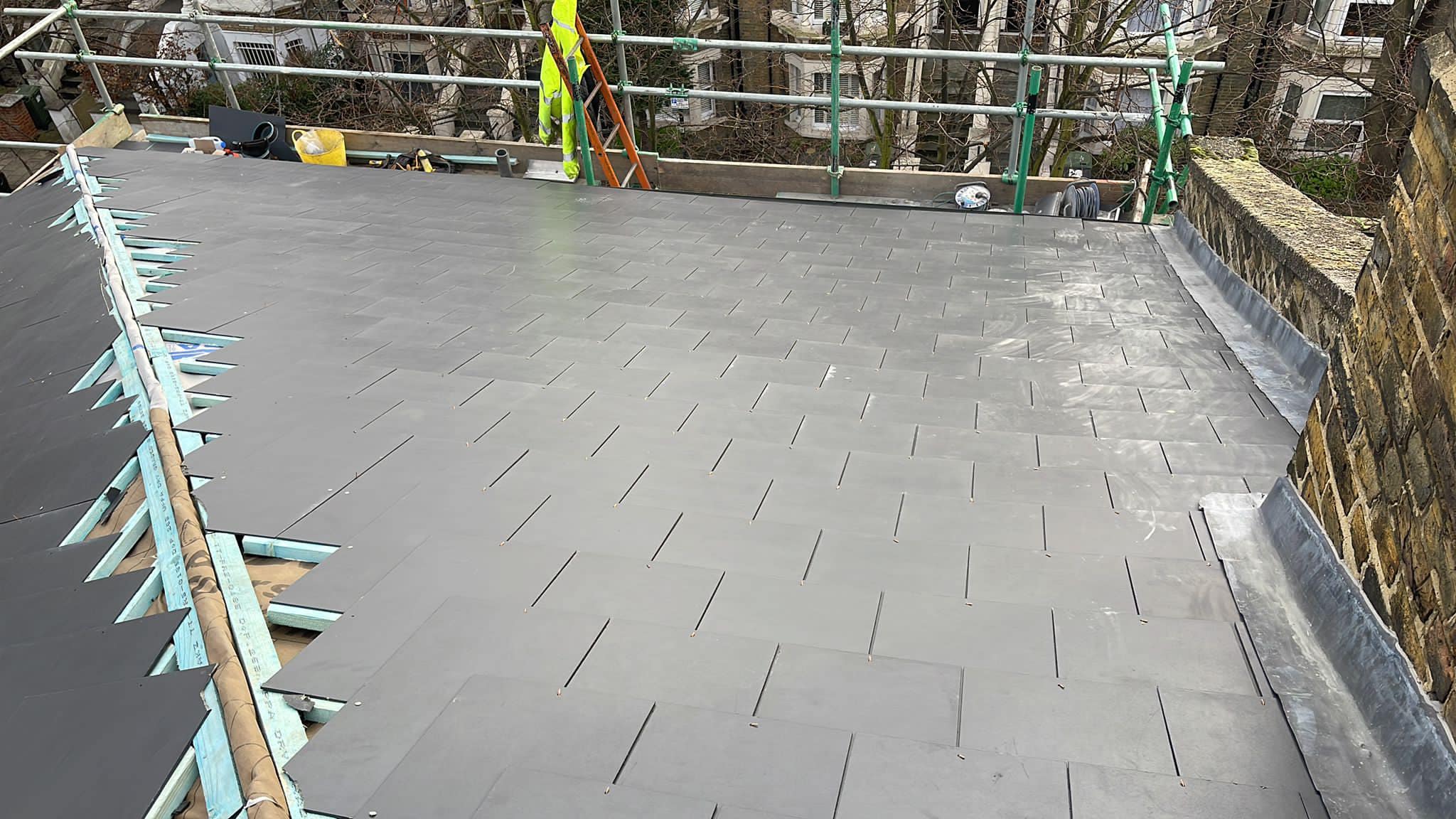 Professional roofers working on a property in London - KS Roof Master