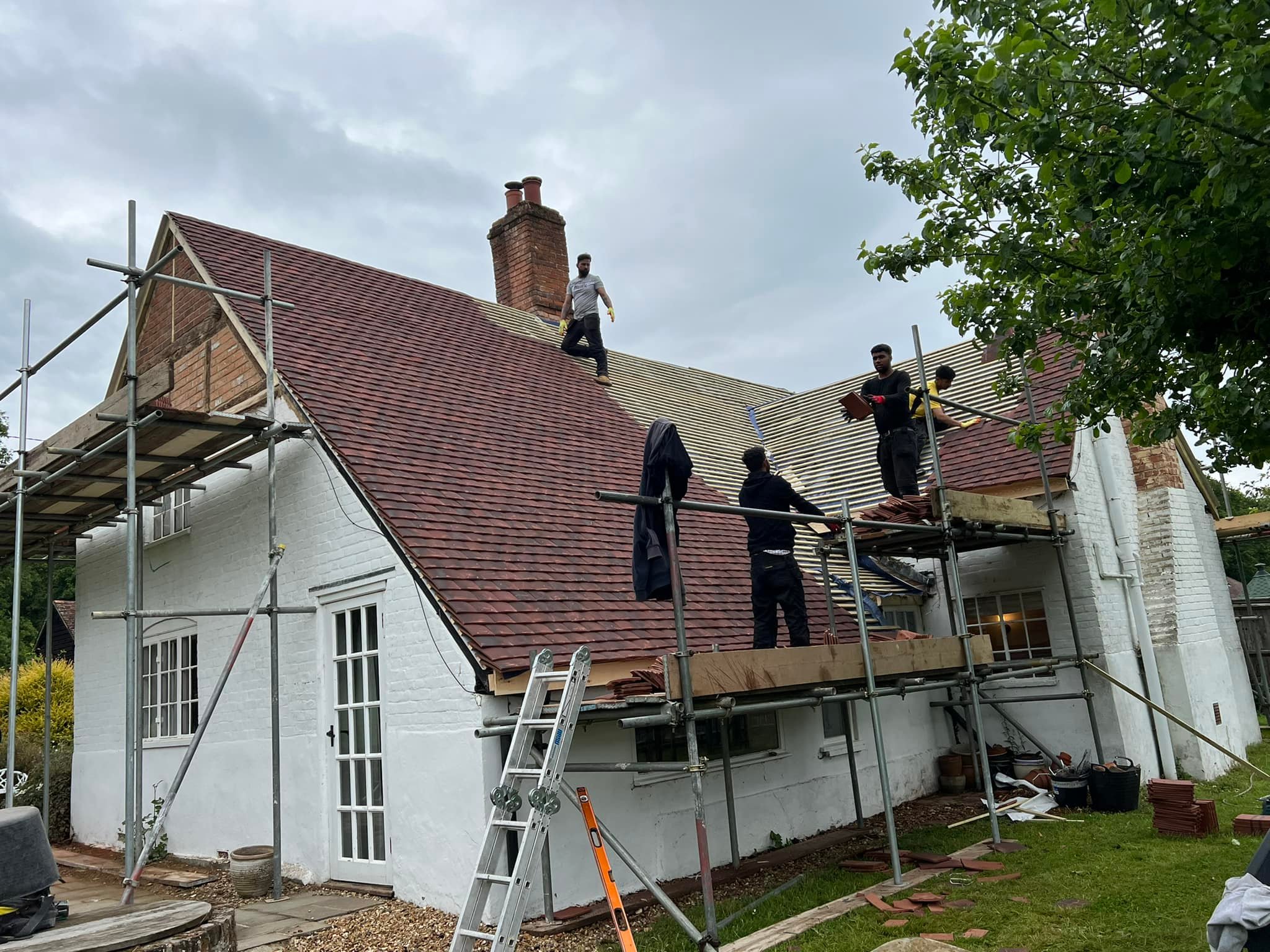 Professional roofers working on a property in London - KS Roof Master