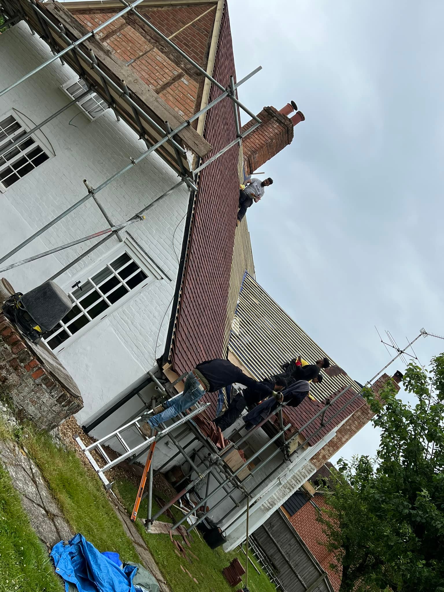 Professional roofers working on a property in London - KS Roof Master