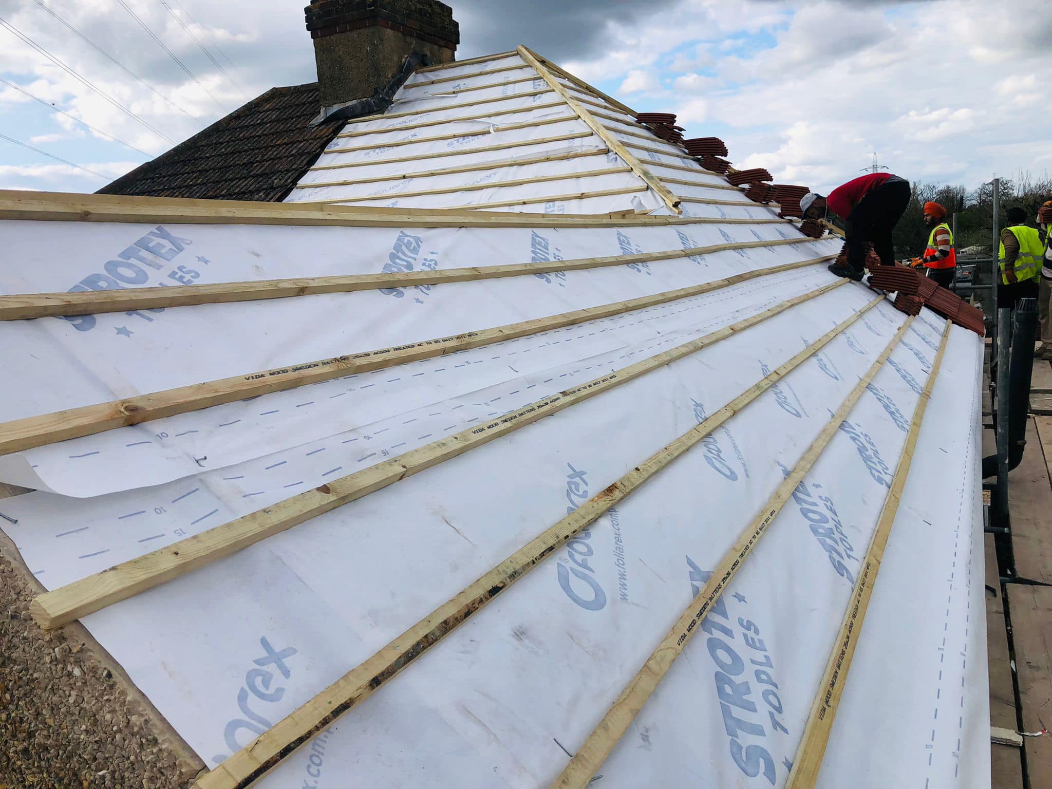 Professional roofers working on a property in London - KS Roof Master