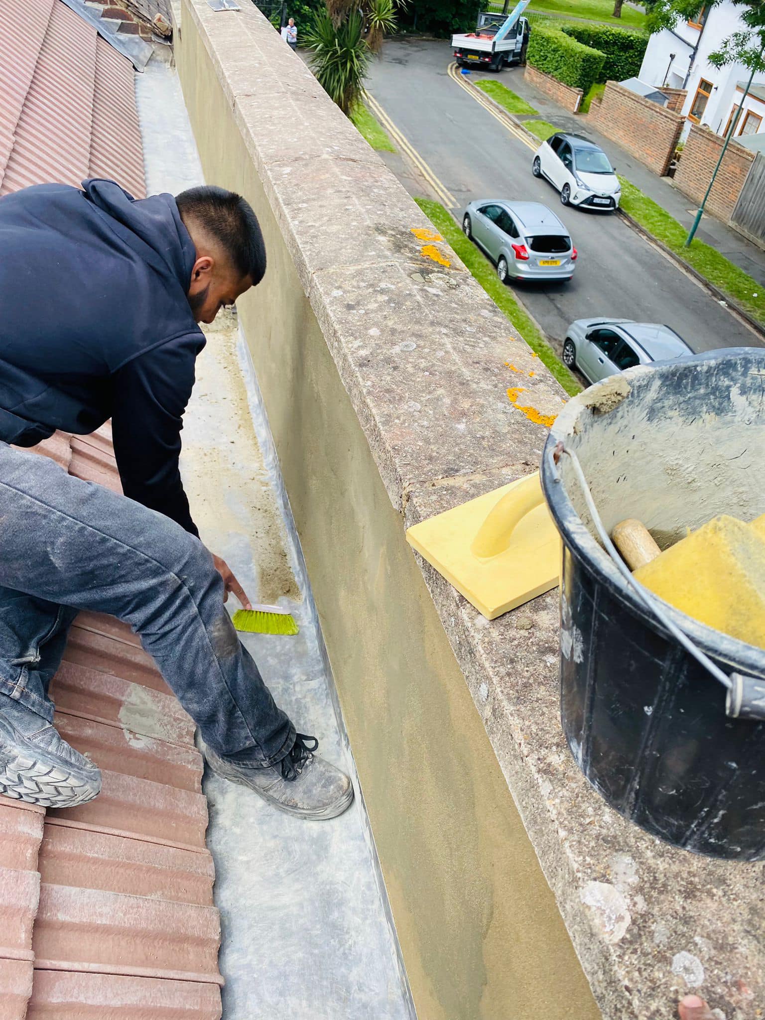 Professional roofers working on a property in London - KS Roof Master