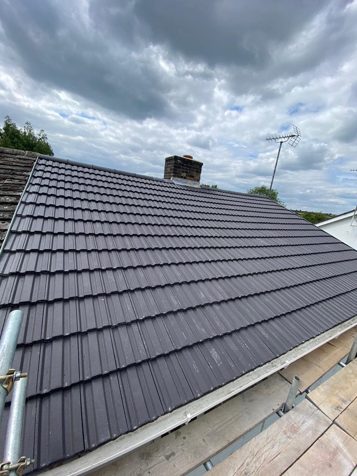 Professional roofers working on a property in London - KS Roof Master