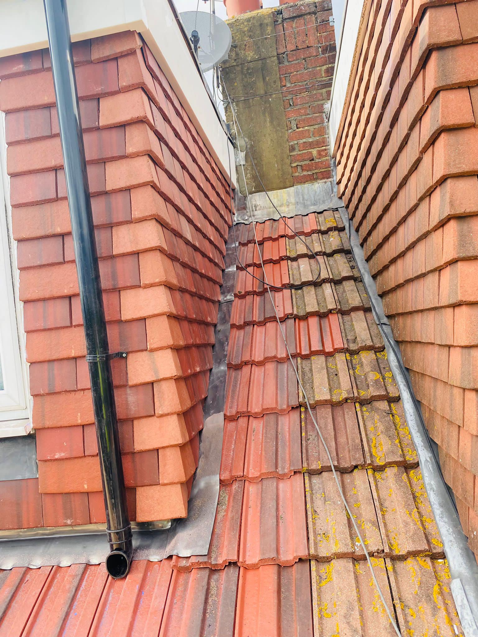 Professional roofers working on a property in London - KS Roof Master