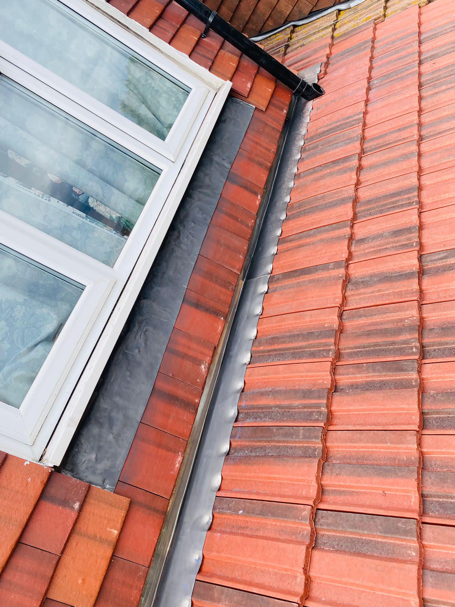 Professional roofers working on a property in London - KS Roof Master