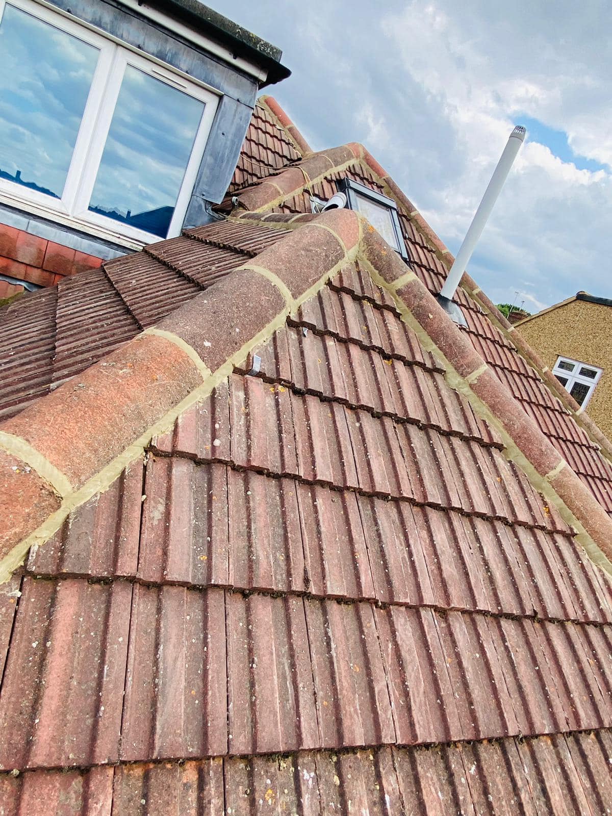 Professional roofers working on a property in London - KS Roof Master