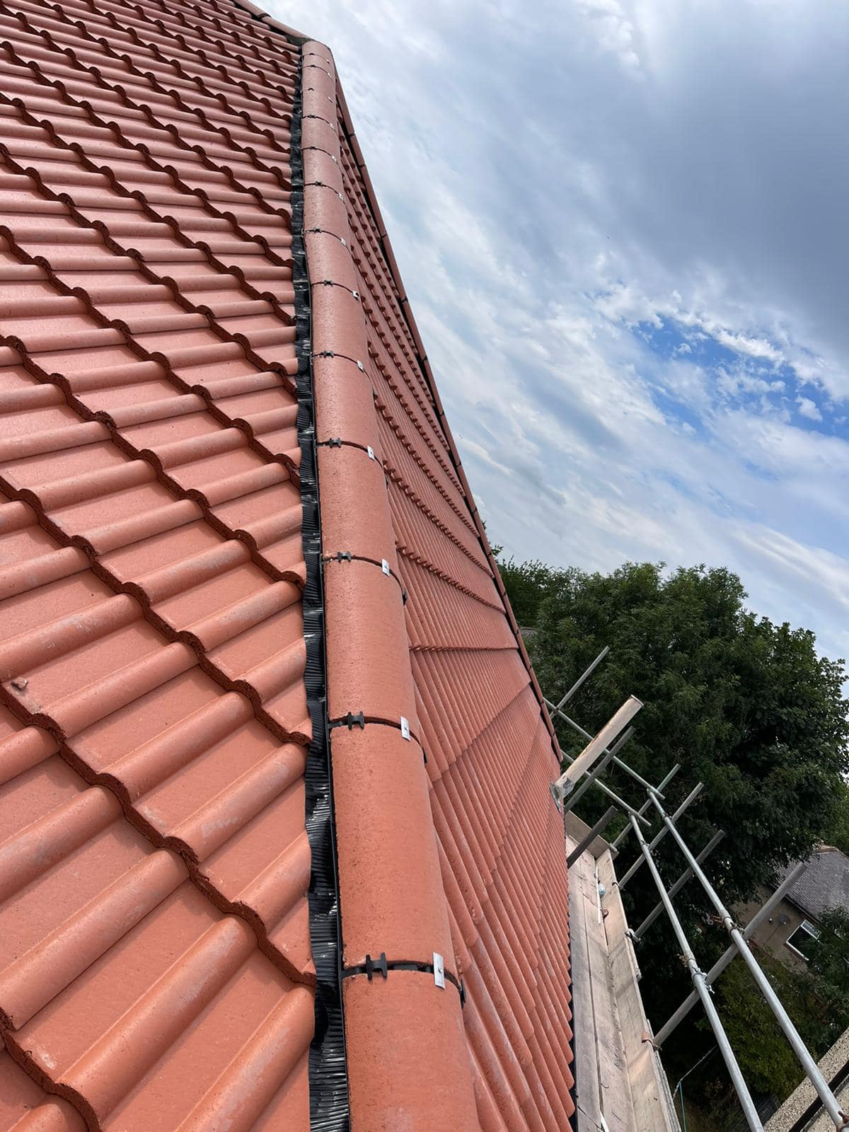 Professional roofers working on a property in London - KS Roof Master