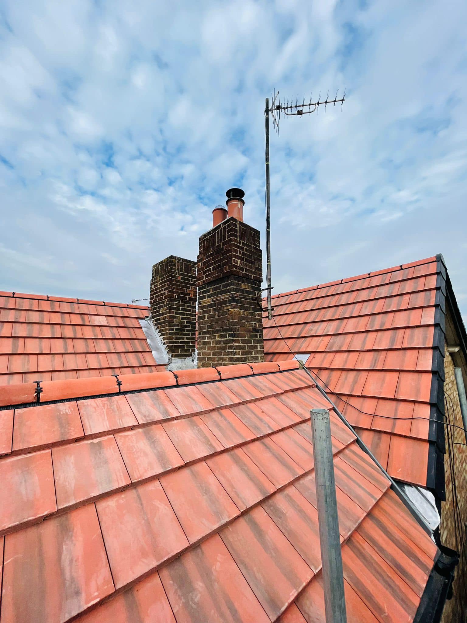 Professional roofers working on a property in London - KS Roof Master