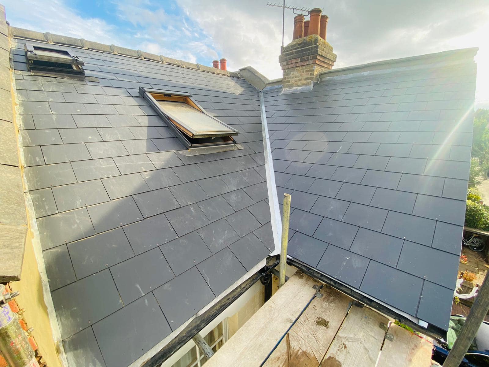 Professional roofers working on a property in London - KS Roof Master