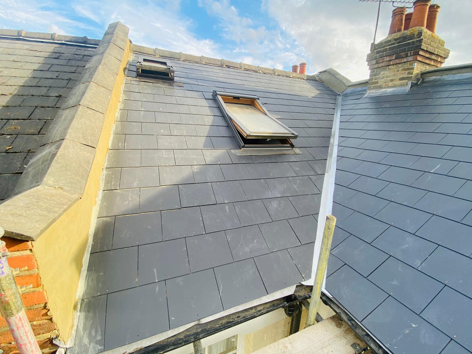 Professional roofers working on a property in London - KS Roof Master