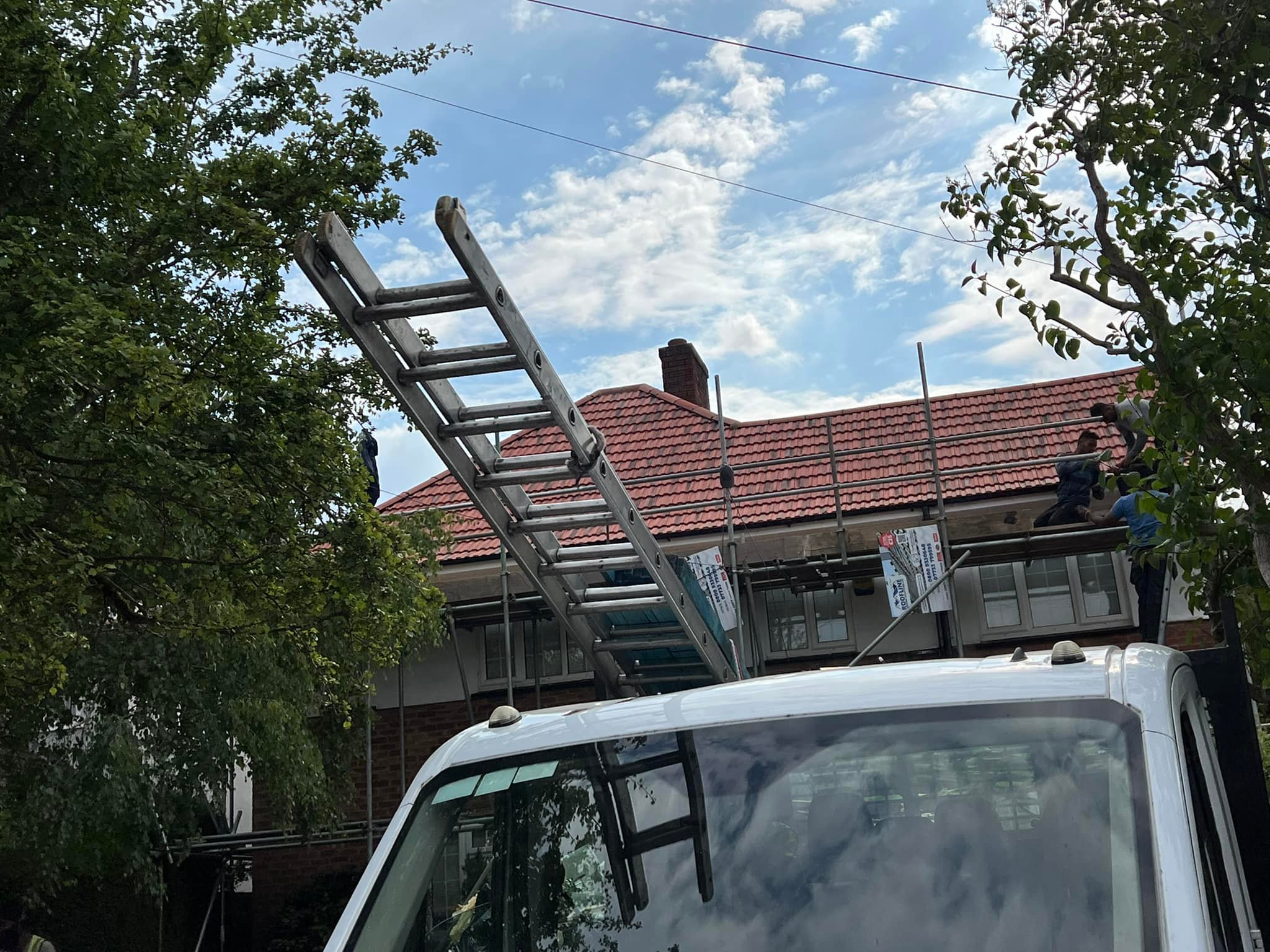 Professional roofers working on a property in London - KS Roof Master