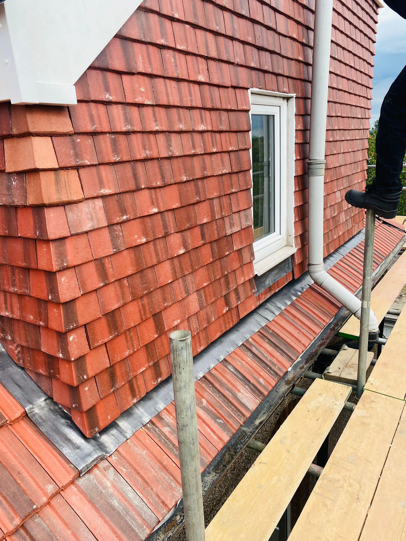 Professional roofers working on a property in London - KS Roof Master