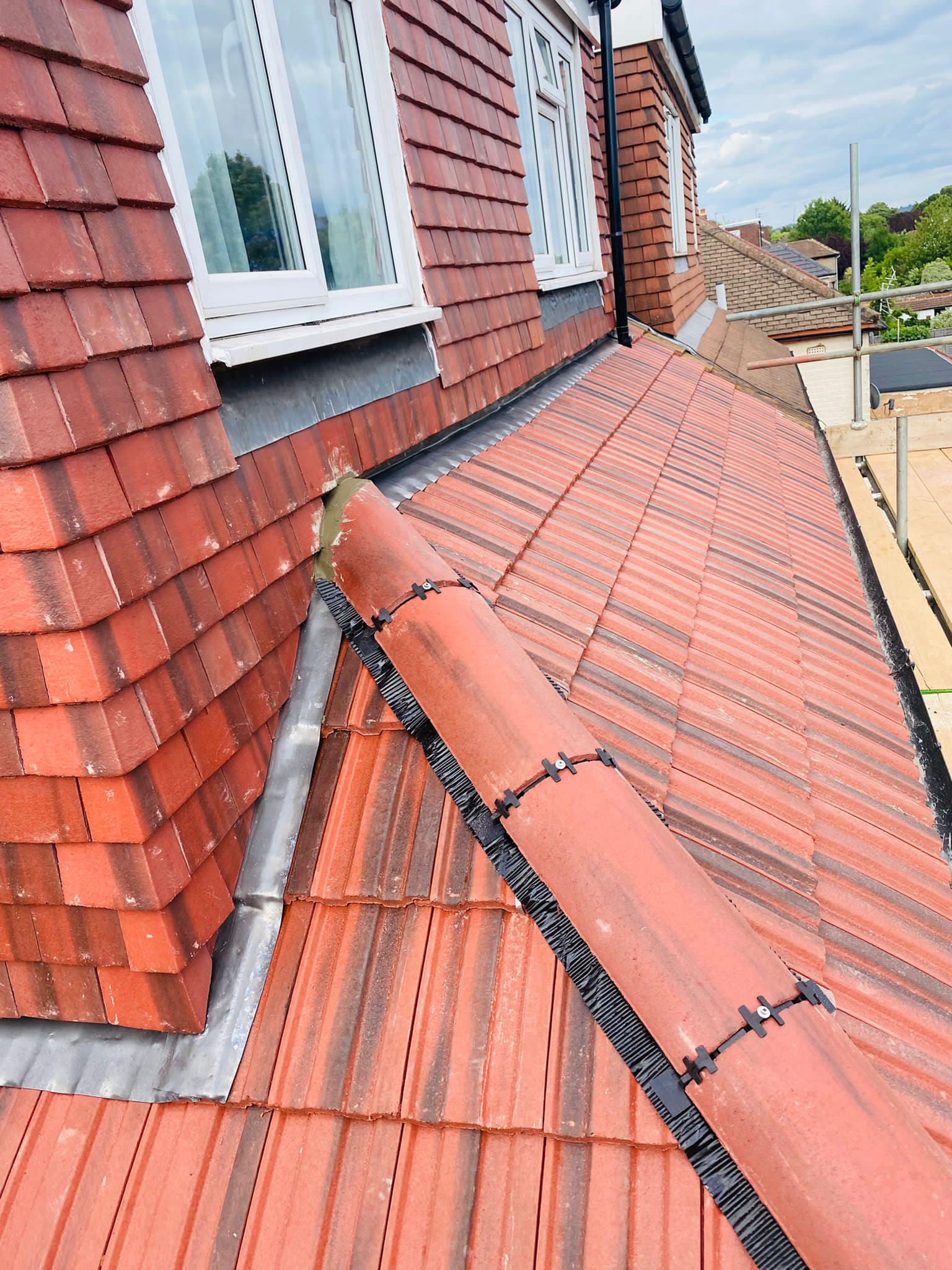 Professional roofers working on a property in London - KS Roof Master