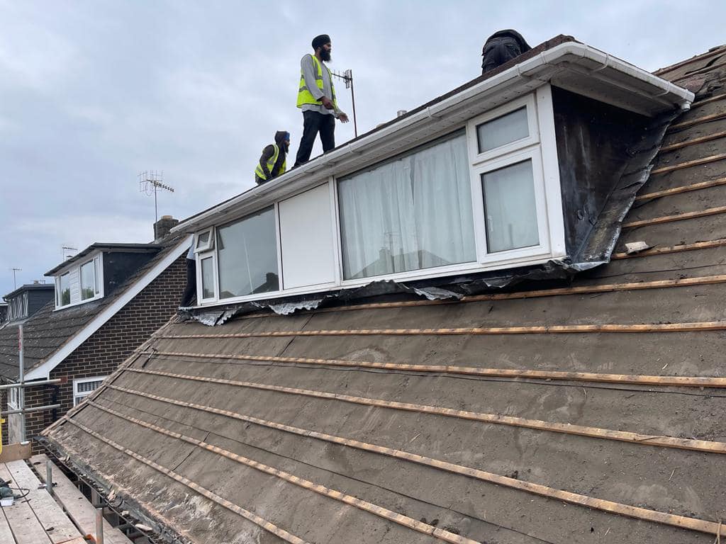 Professional roofers working on a property in London - KS Roof Master