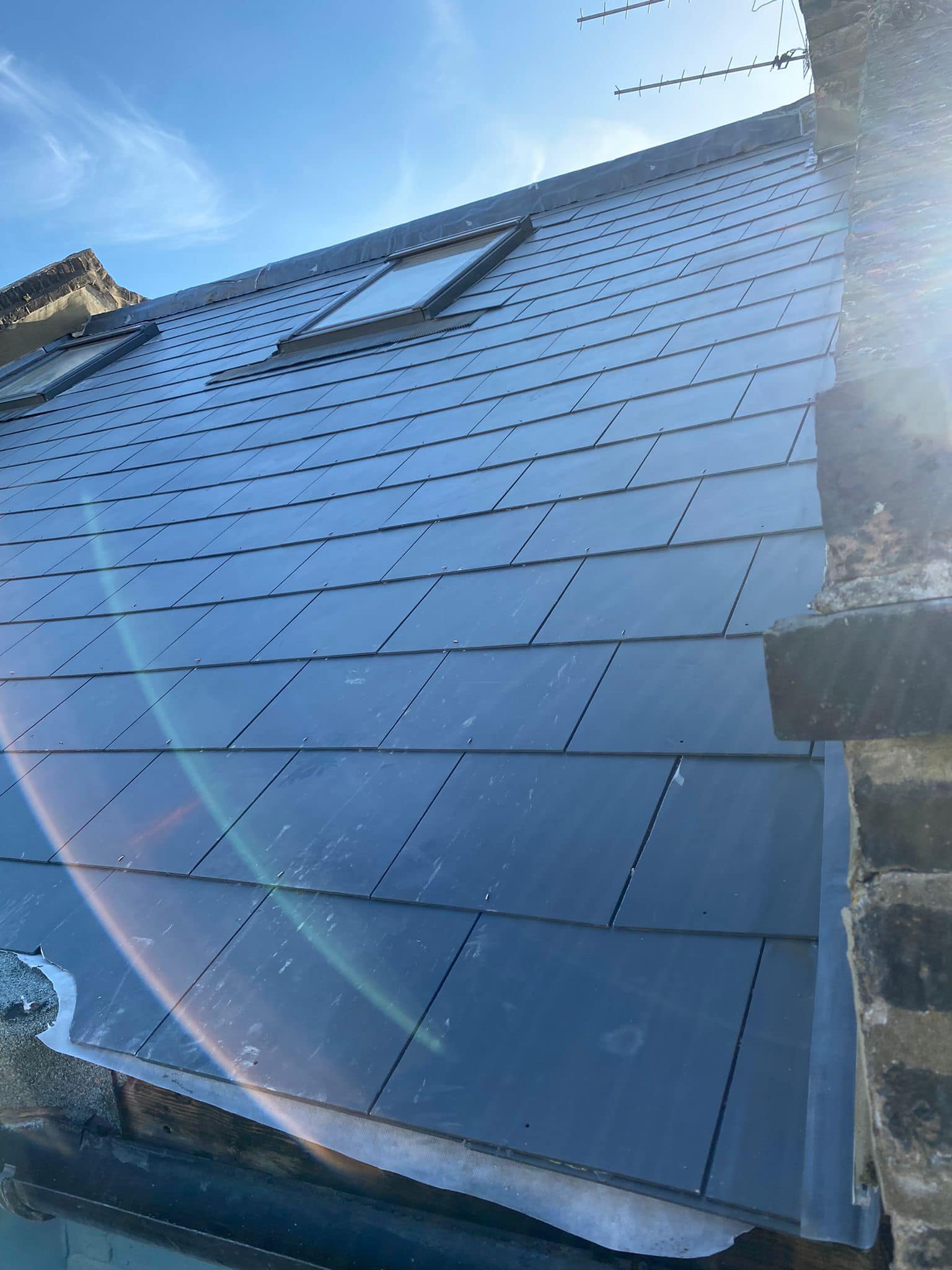 Professional roofers working on a property in London - KS Roof Master