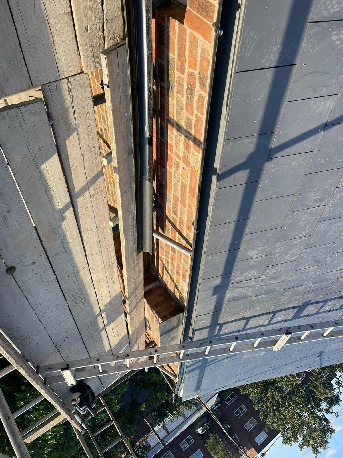 Professional roofers working on a property in London - KS Roof Master