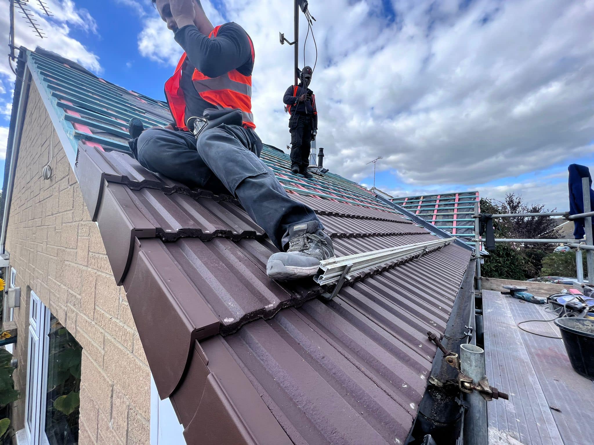 Professional roofers working on a property in London - KS Roof Master