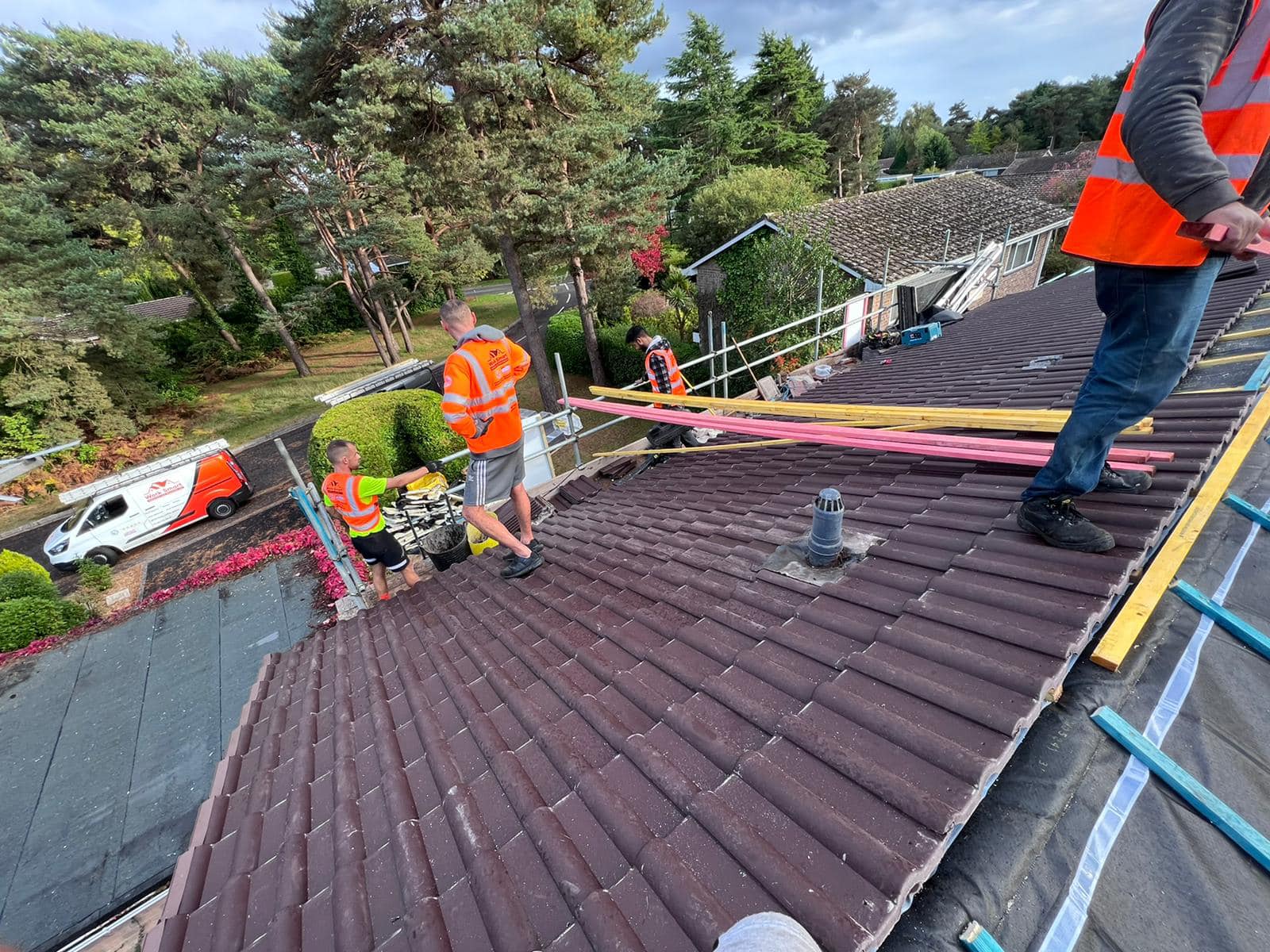 Professional roofers working on a property in London - KS Roof Master