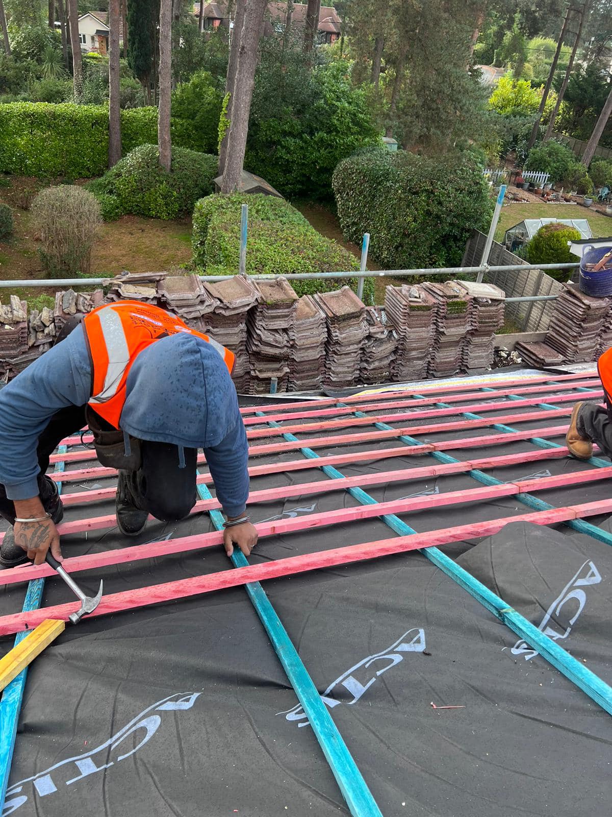 Professional roofers working on a property in London - KS Roof Master