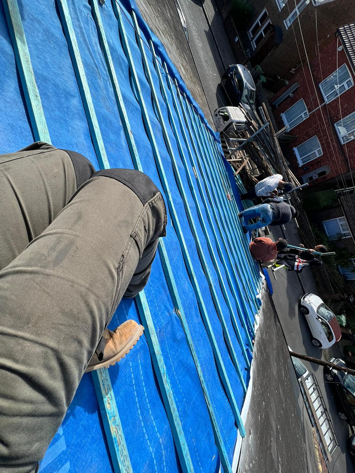 Professional roofers working on a property in London - KS Roof Master