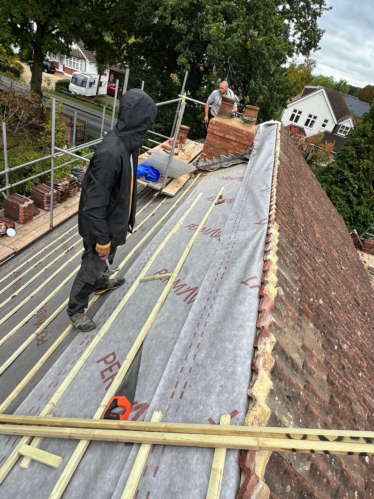 Professional roofers working on a property in London - KS Roof Master