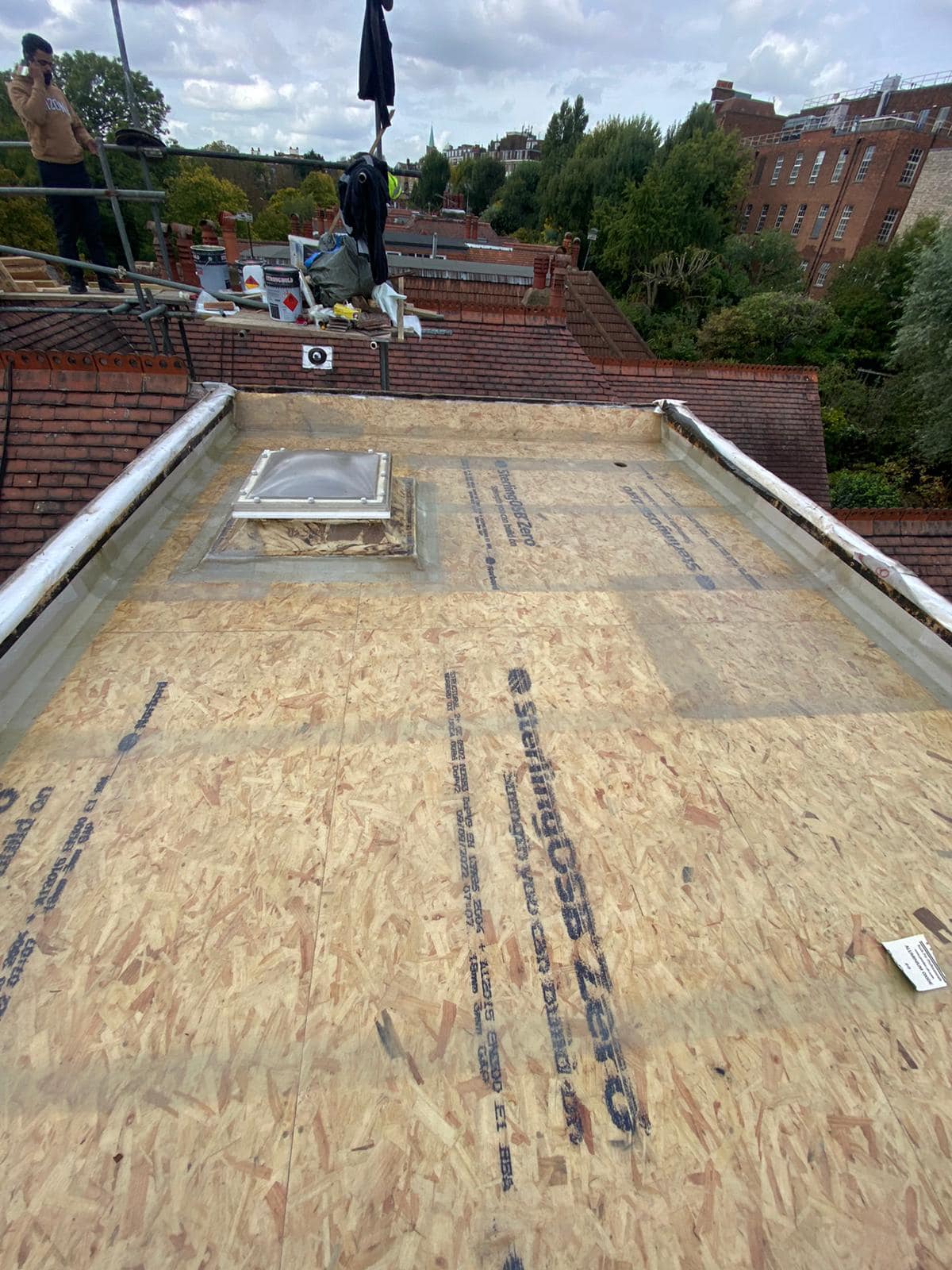 Professional roofers working on a property in London - KS Roof Master
