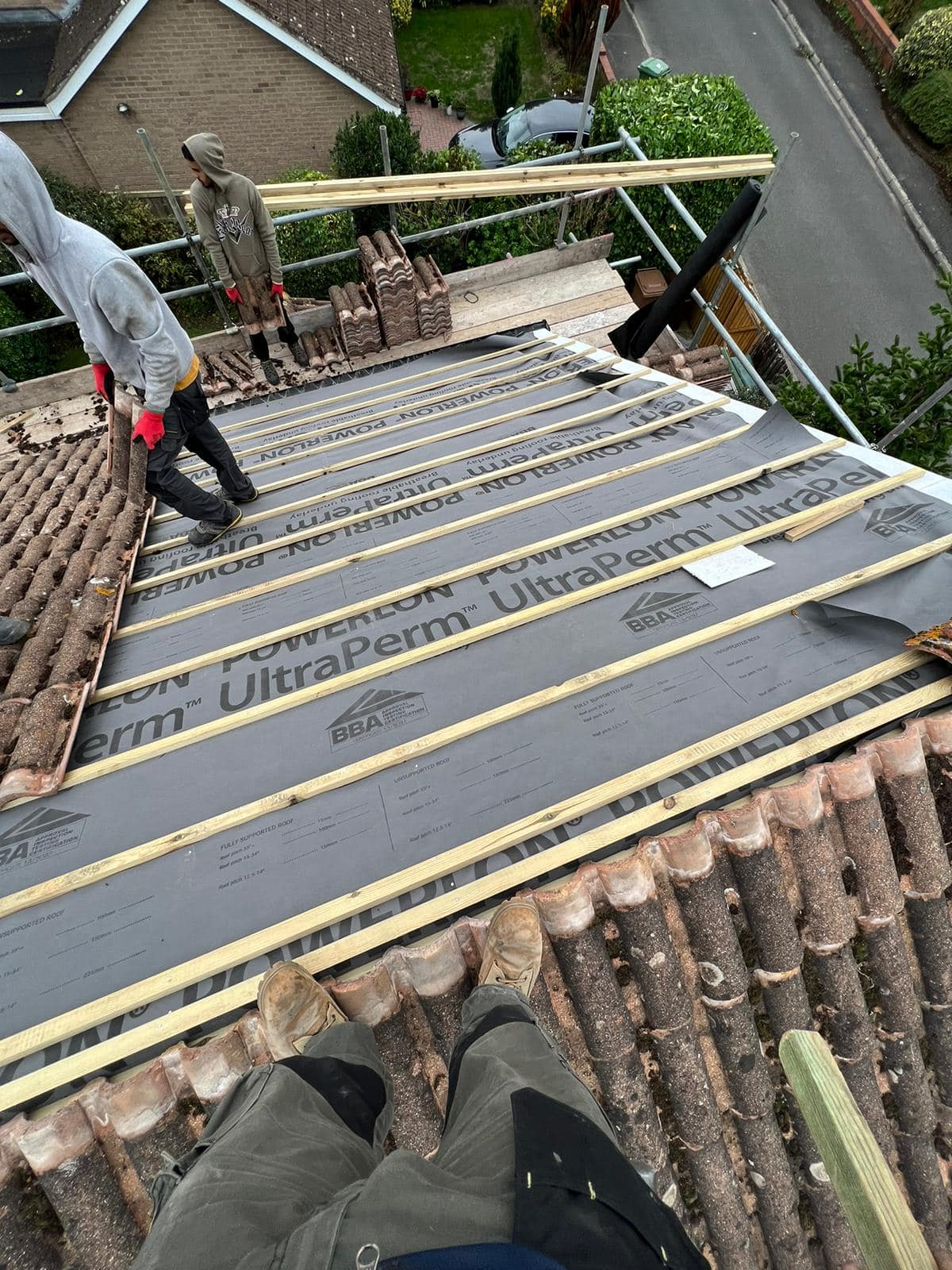 Professional roofers working on a property in London - KS Roof Master