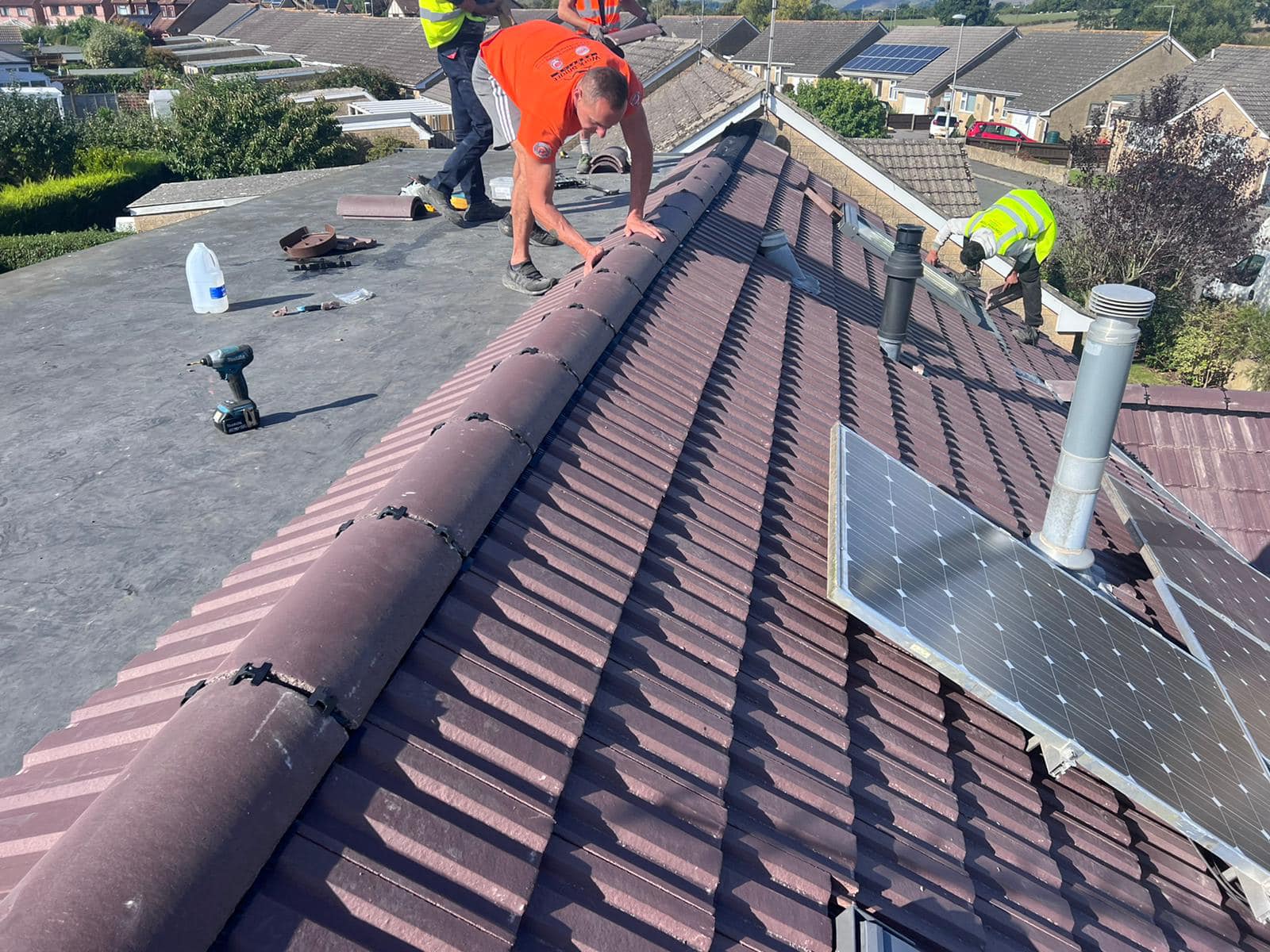 Professional roofers working on a property in London - KS Roof Master