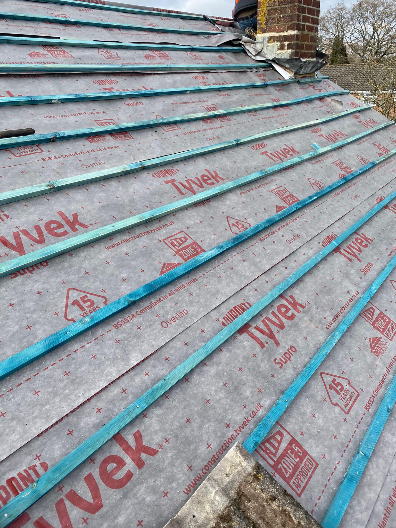 Professional roofers working on a property in London - KS Roof Master