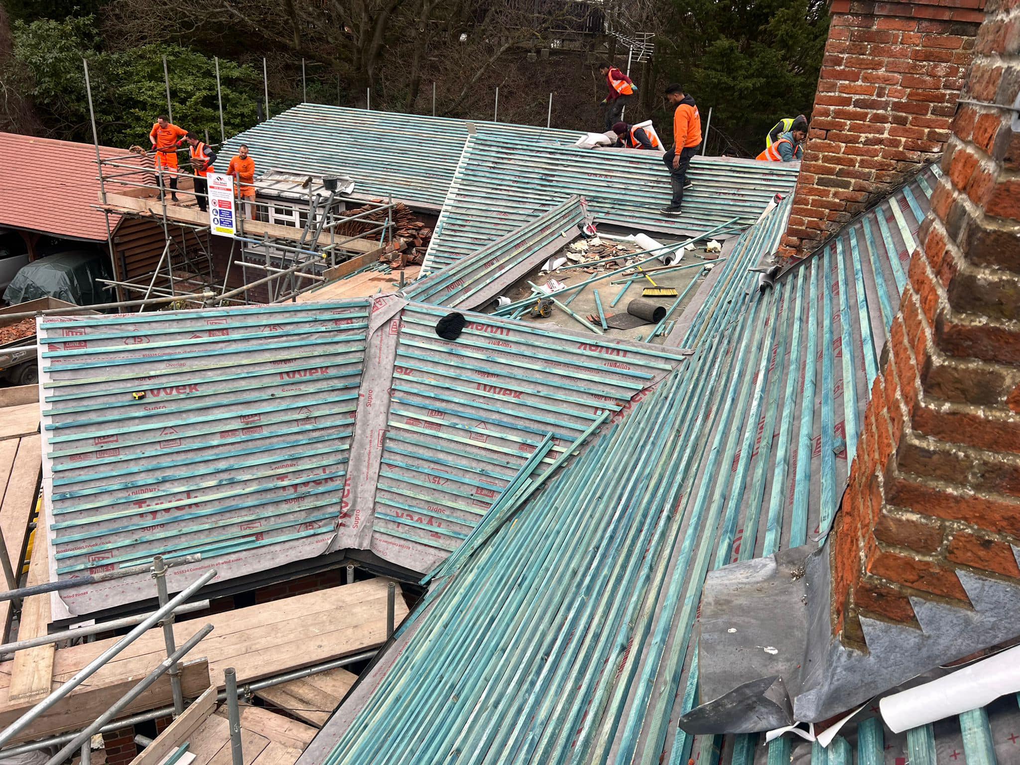 Professional roofers working on a property in London - KS Roof Master