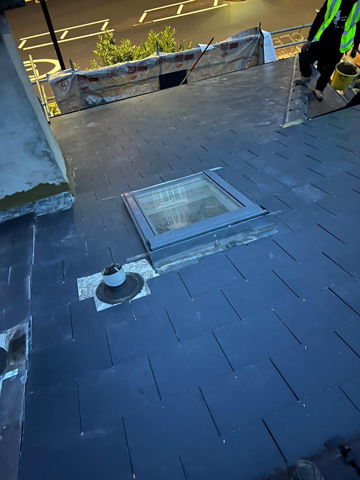 Professional roofers working on a property in London - KS Roof Master