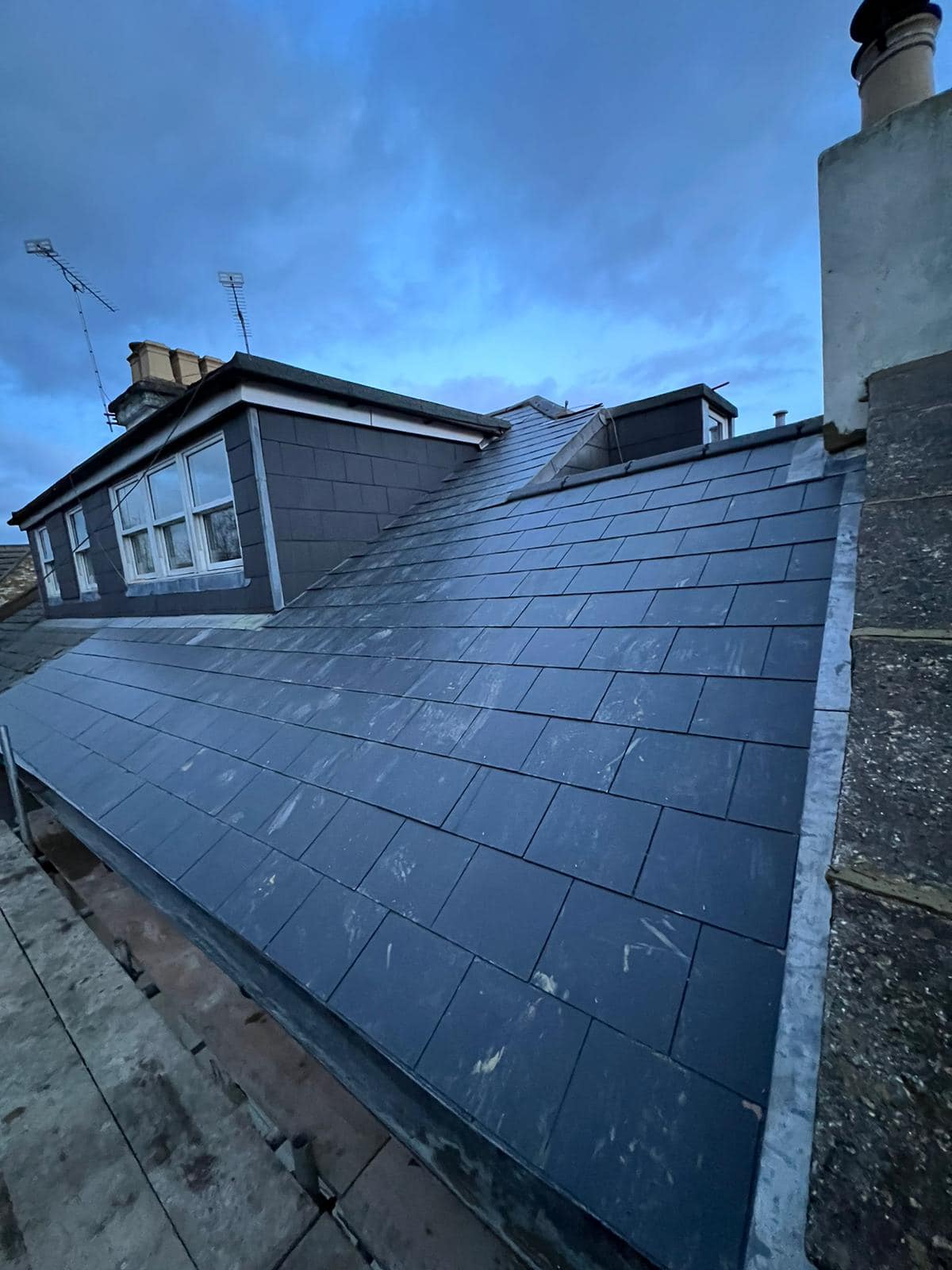 Professional roofers working on a property in London - KS Roof Master