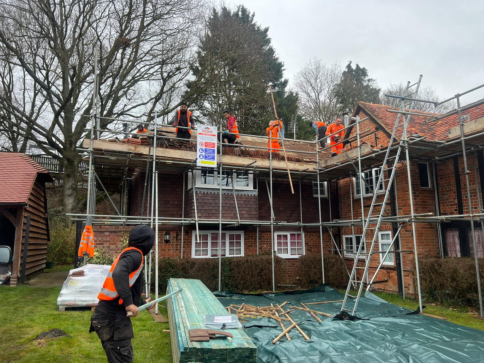 Professional roofers working on a property in London - KS Roof Master