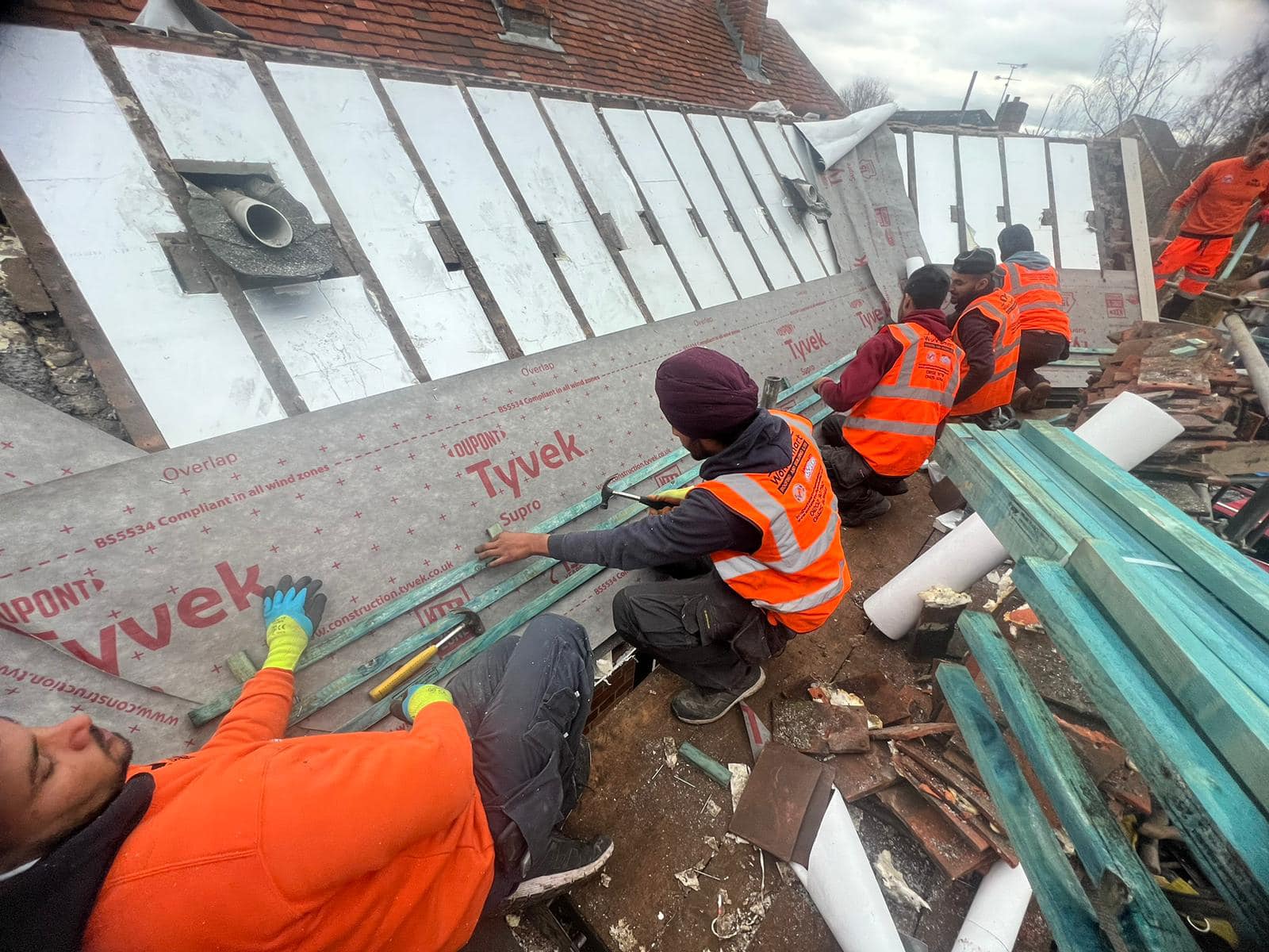 Professional roofers working on a property in London - KS Roof Master