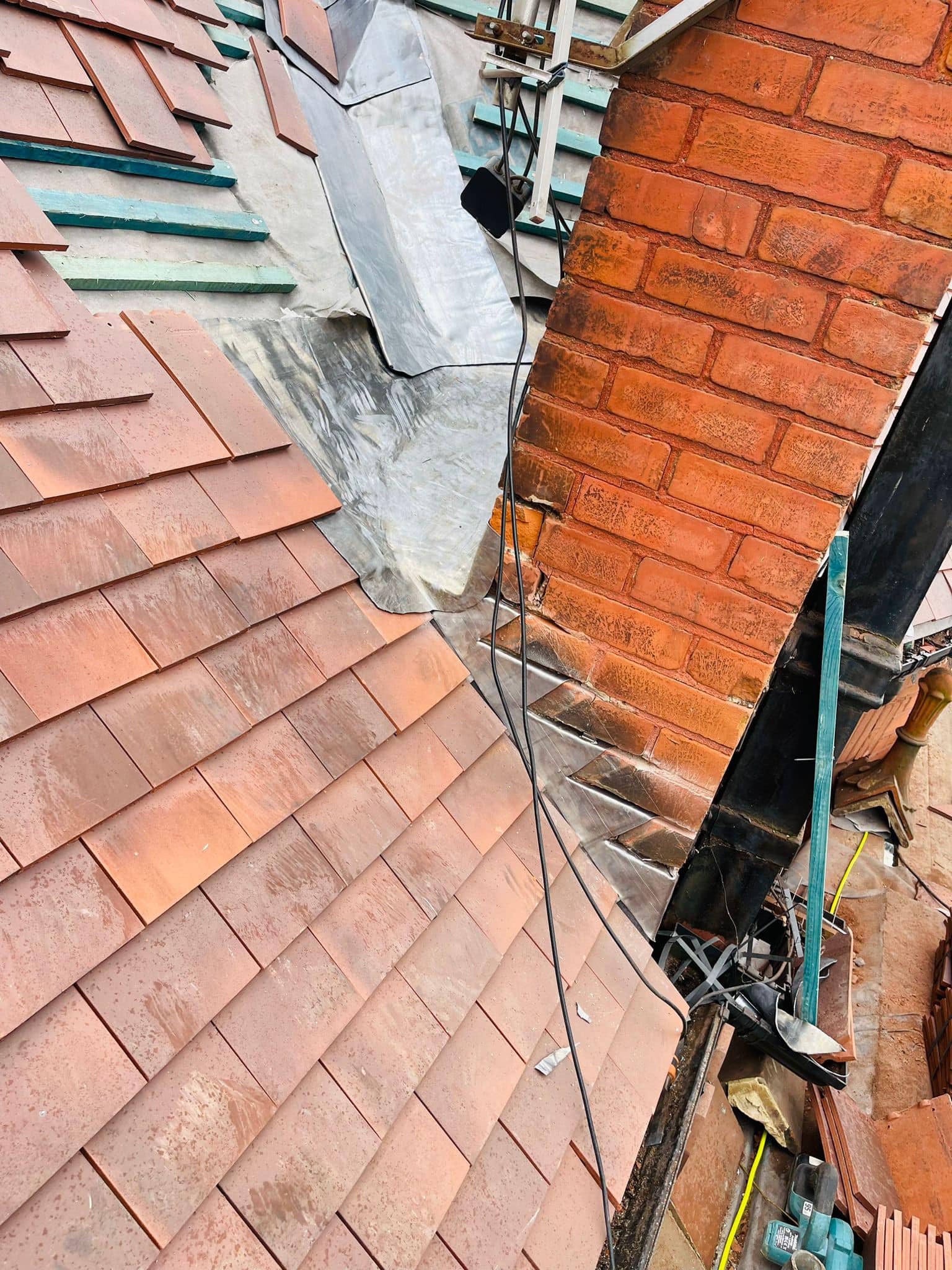 Professional roofers working on a property in London - KS Roof Master