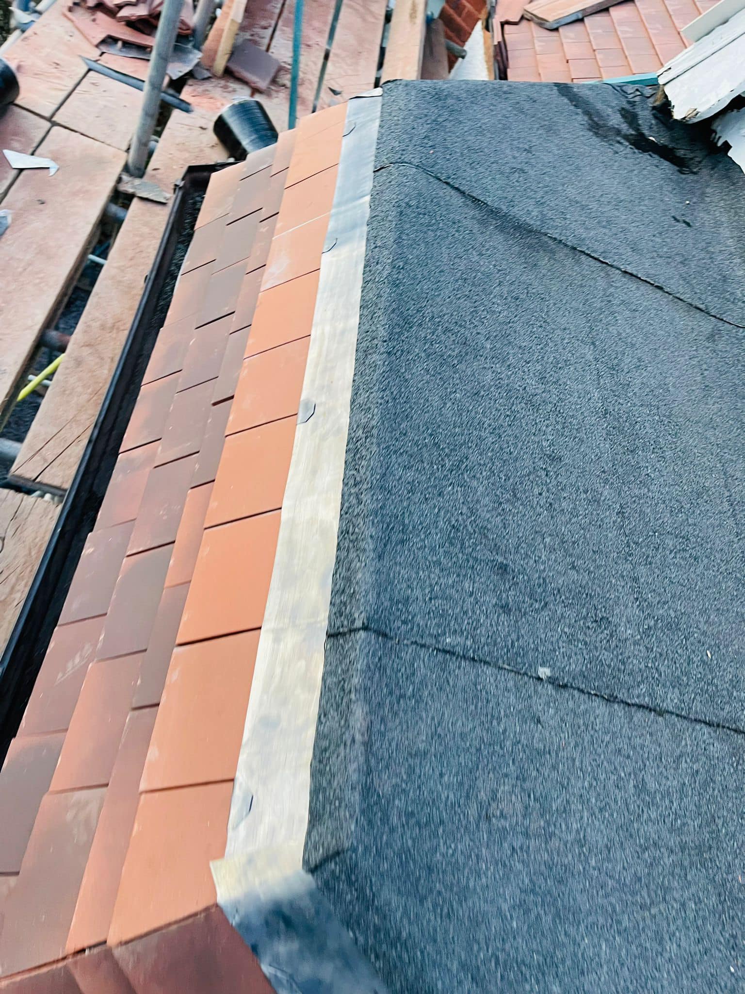 Professional roofers working on a property in London - KS Roof Master