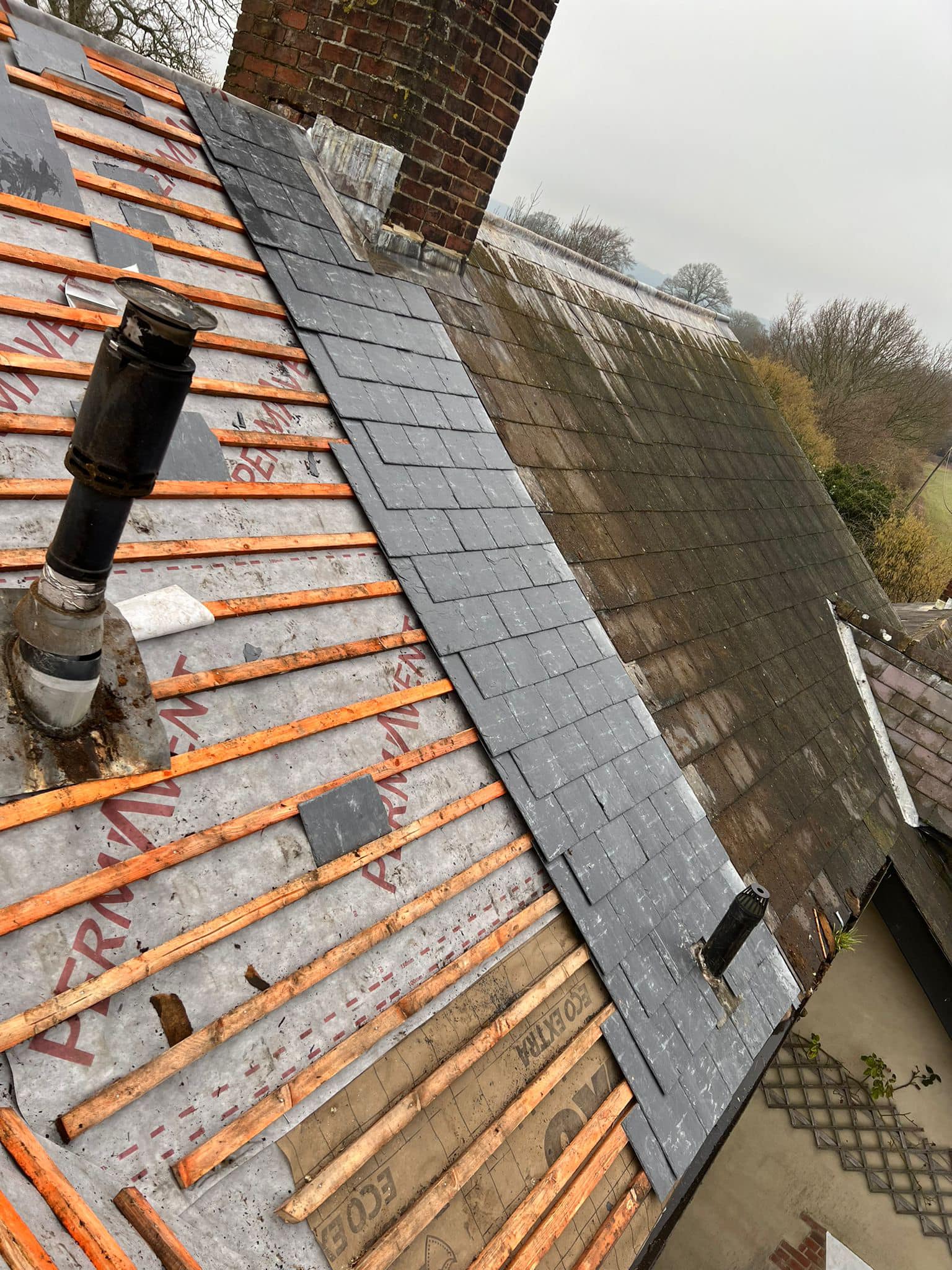 Professional roofers working on a property in London - KS Roof Master