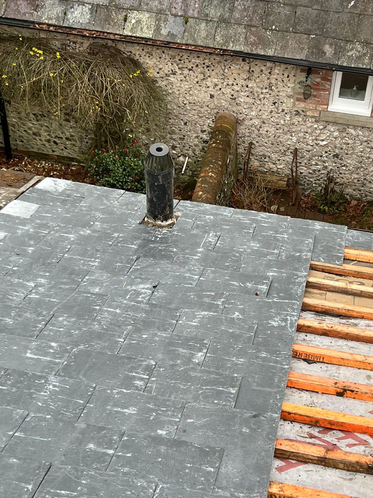 Professional roofers working on a property in London - KS Roof Master