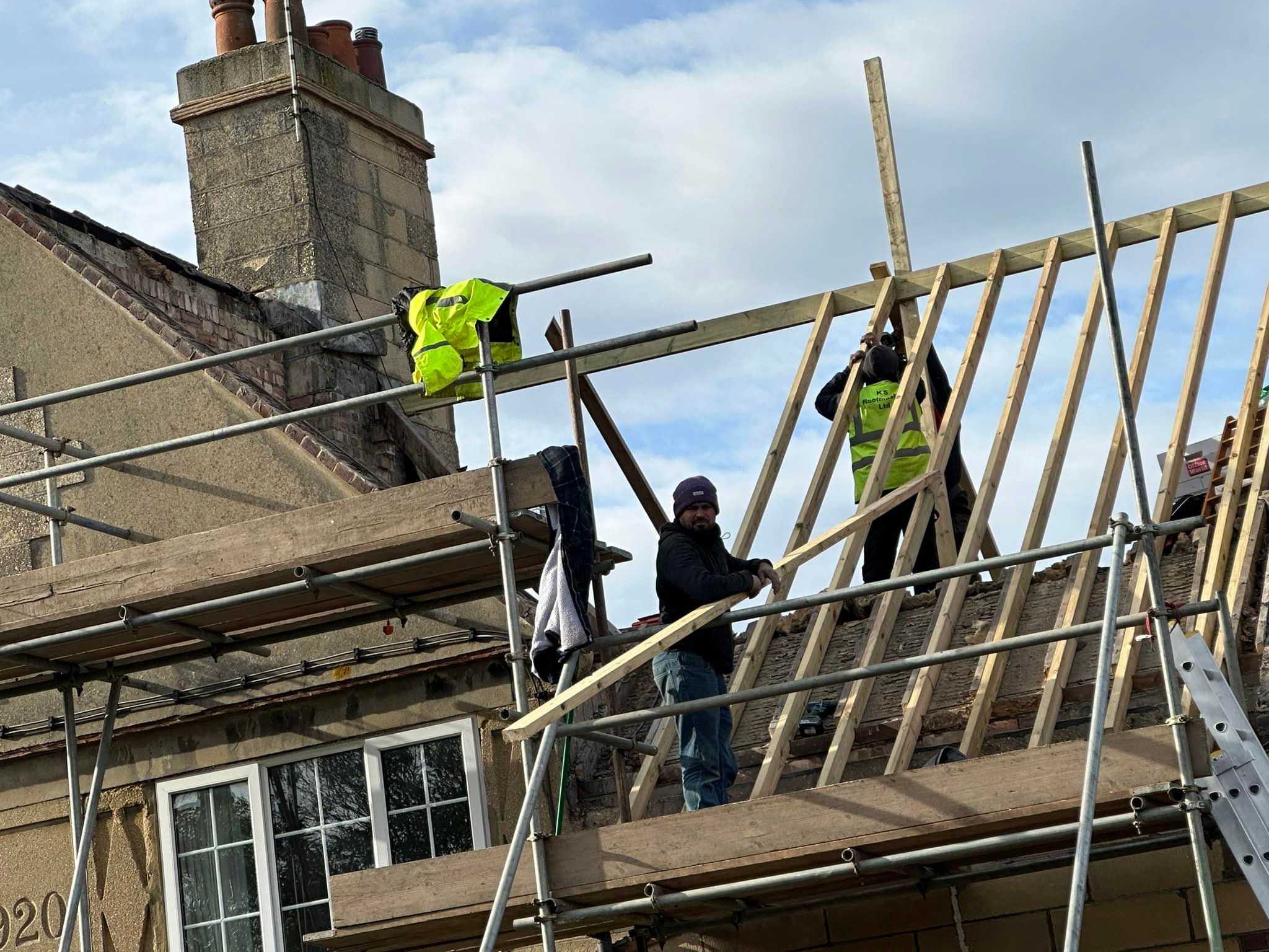 Professional roofers working on a property in London - KS Roof Master